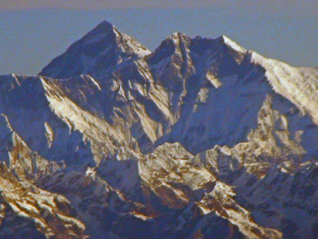 Manaslu 00 03 Everest and Lhotse From Flight To Kathmandu As we waited for Kathmandu cloud cover to clear, we had a good early morning view of Mount Everest sticking up above the Lhotse south face.